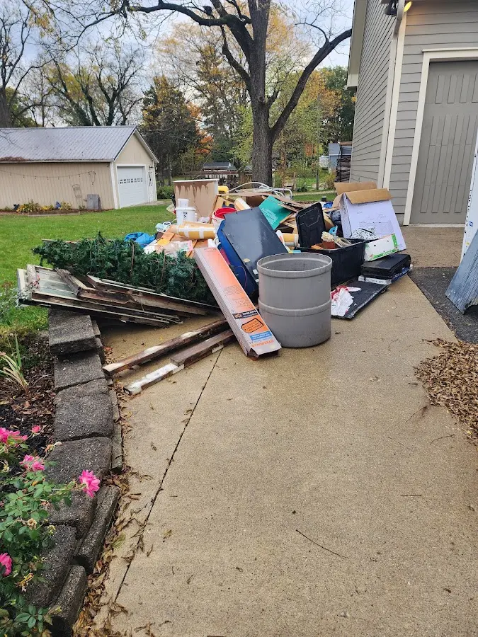 Dumpster being loaded with debris for 30 Yard Dumpster Rental in Greensboro